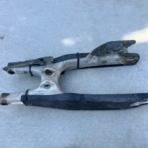 Swing Arm With Bearings, Chain Sliders And Chain Adjuster Bolts.